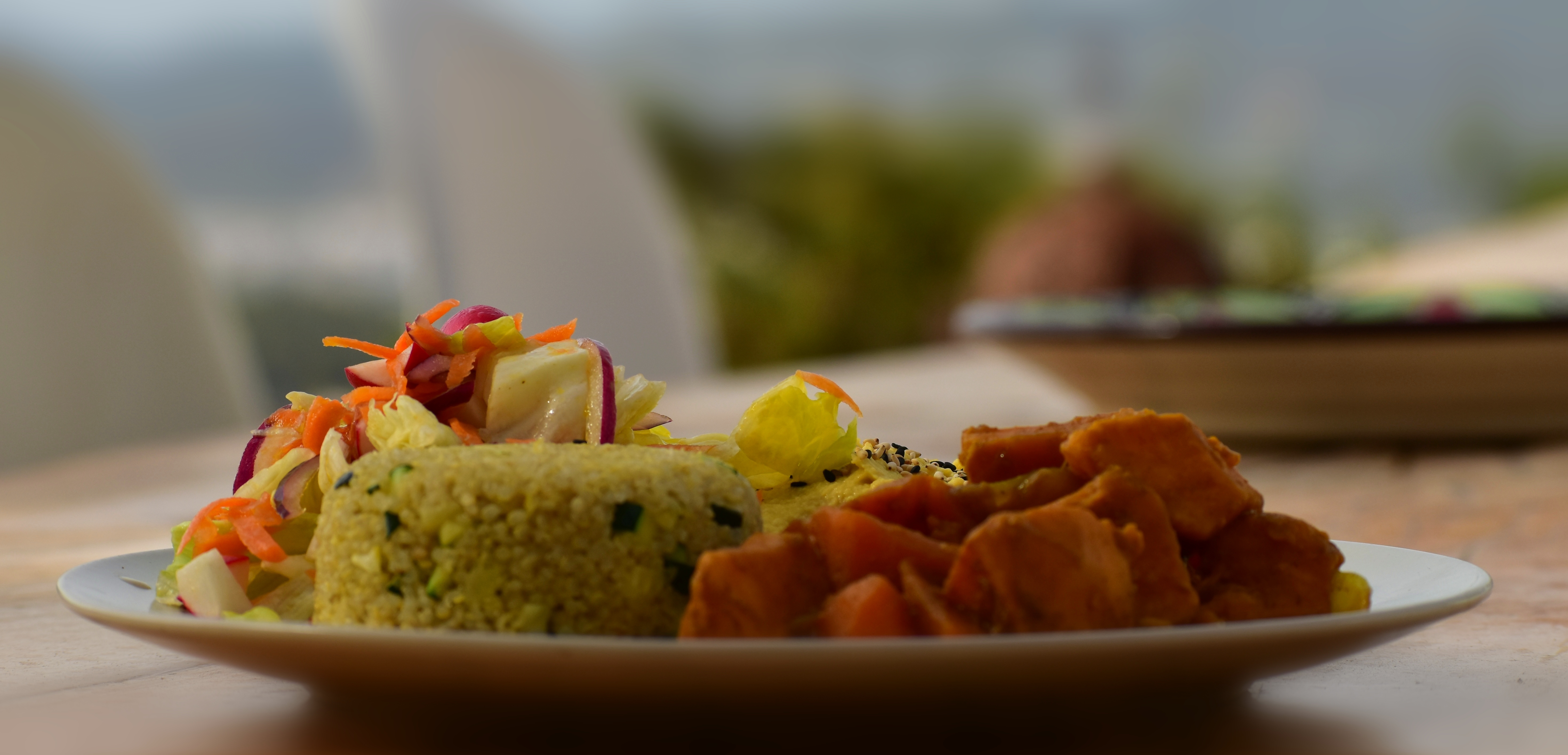 Colorful plated dish with rice and curry
